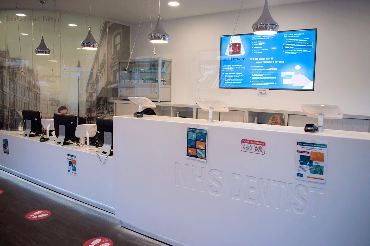 The NHS Dentist reception with digital information screens